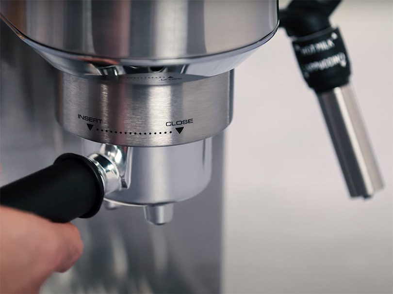 Locking the portafilter into place on the DeLonghi Dedica Deluxe